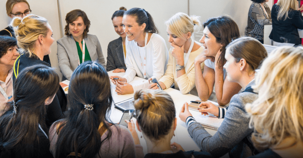 A group of women conversing at the herCareer Expo